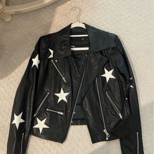Black leather jacket with white stars